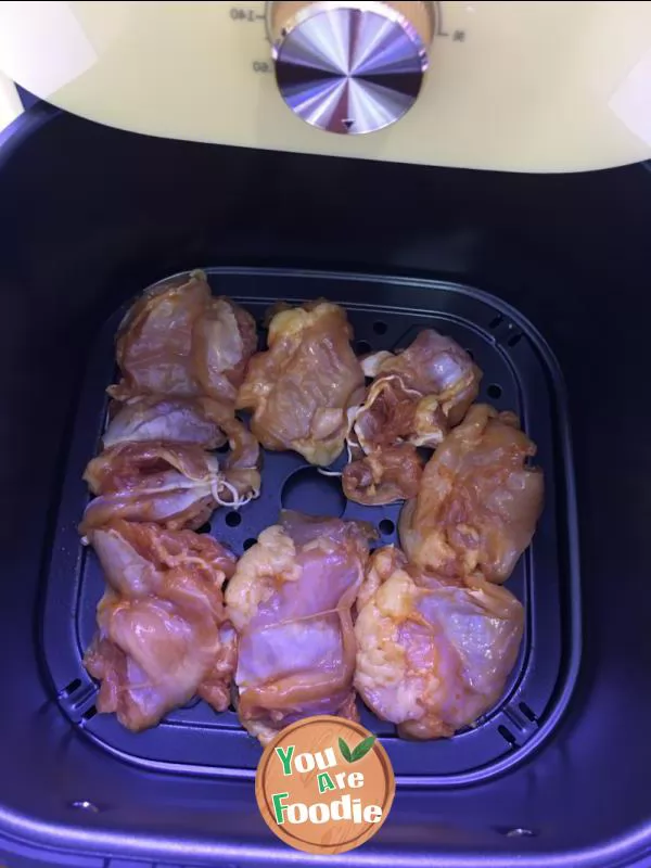 Fried chicken leg in air frying pan