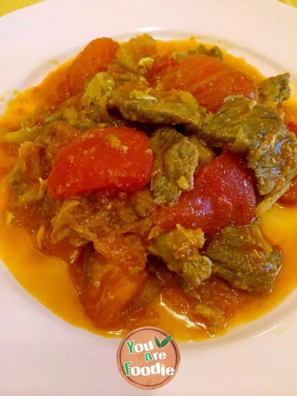 Fried beef with tomato and scallion
