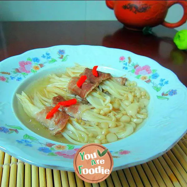Steamed pork rolls with golden mushrooms