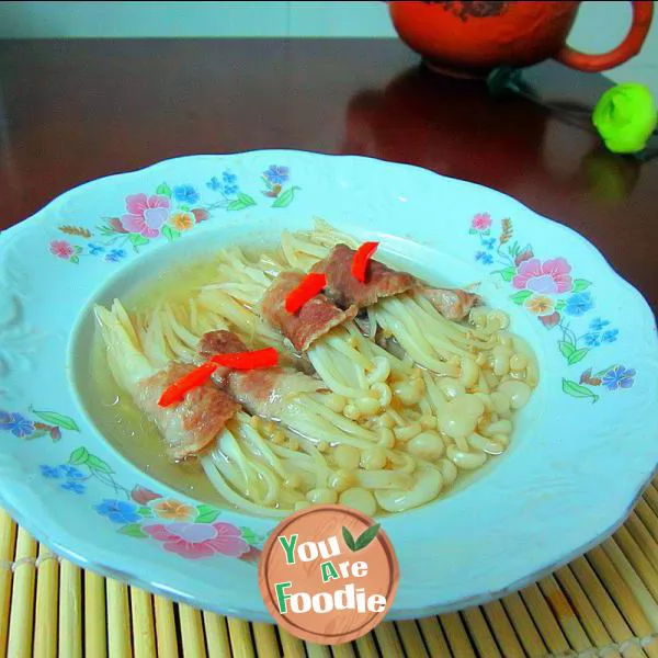 Steamed pork rolls with golden mushrooms