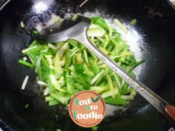 Fried celery with leek sprouts