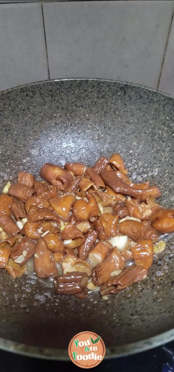 Stir fried large intestine with garlic sprouts
