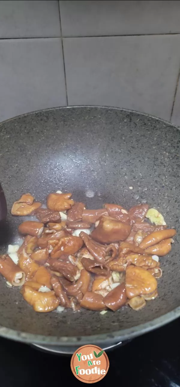 Stir fried large intestine with garlic sprouts